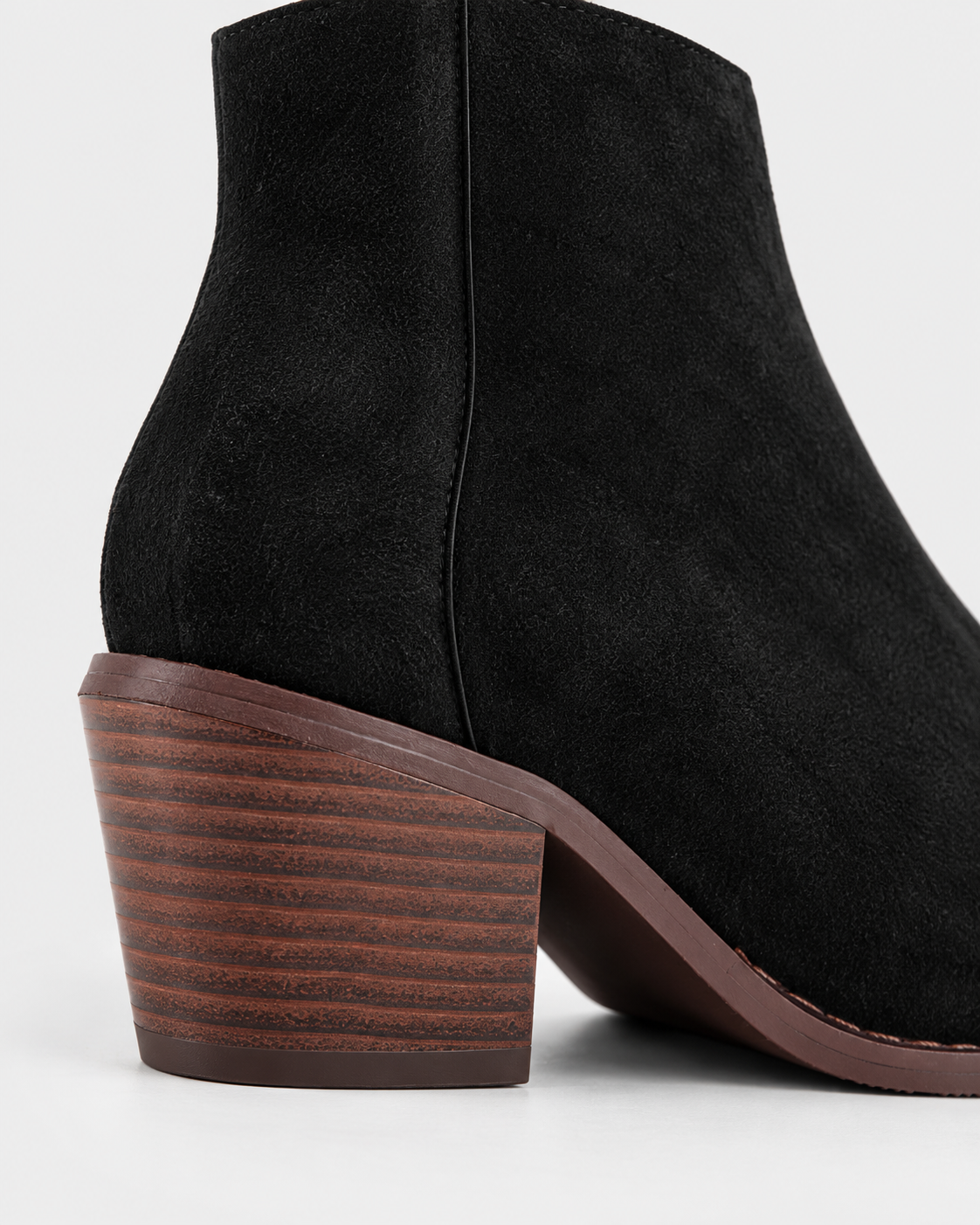 Black | Rear close-up of block heel and ankle shaft on black heeled boot