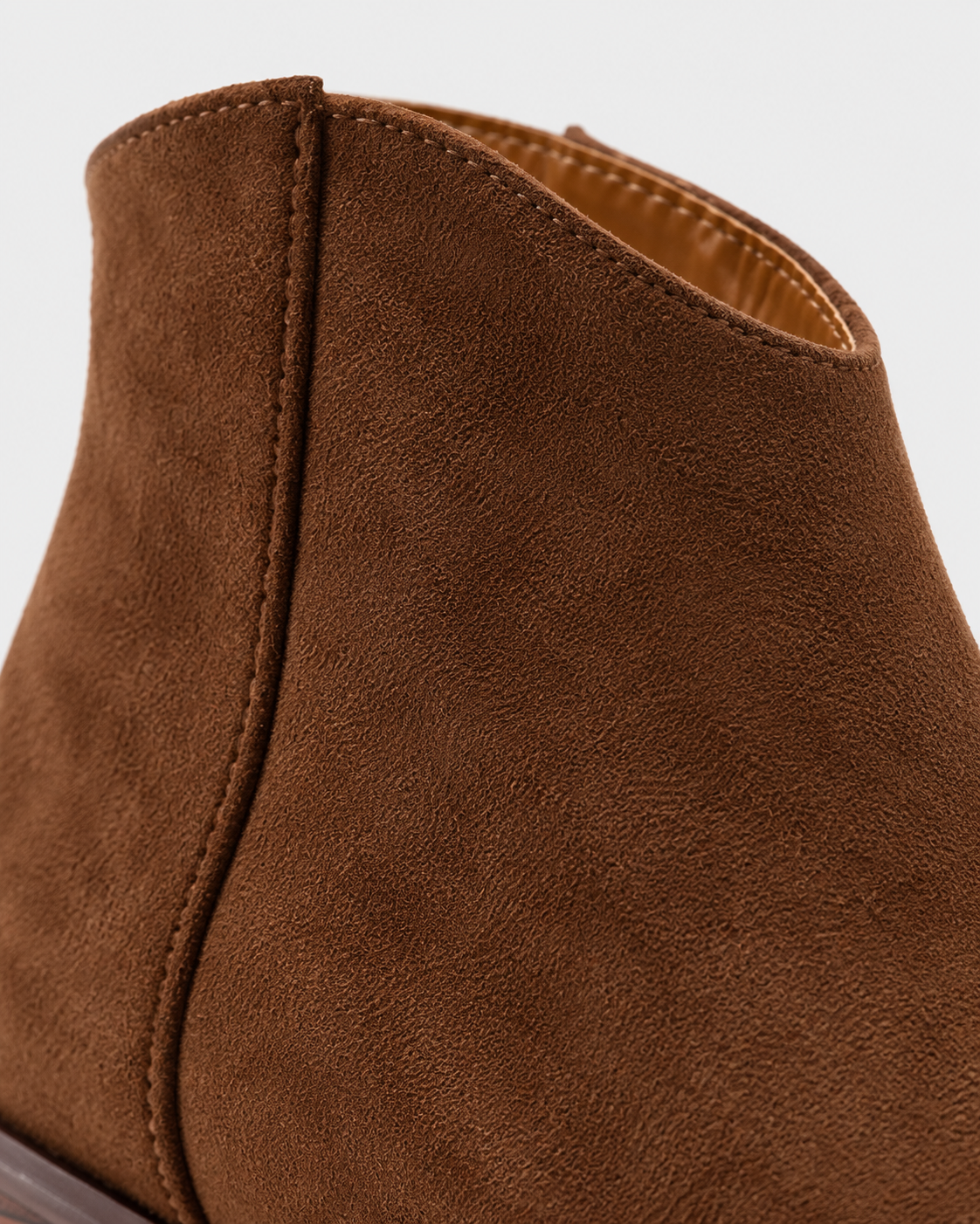 Image of Brown | Angled view of brown heeled ankle boots showing ankle shafts