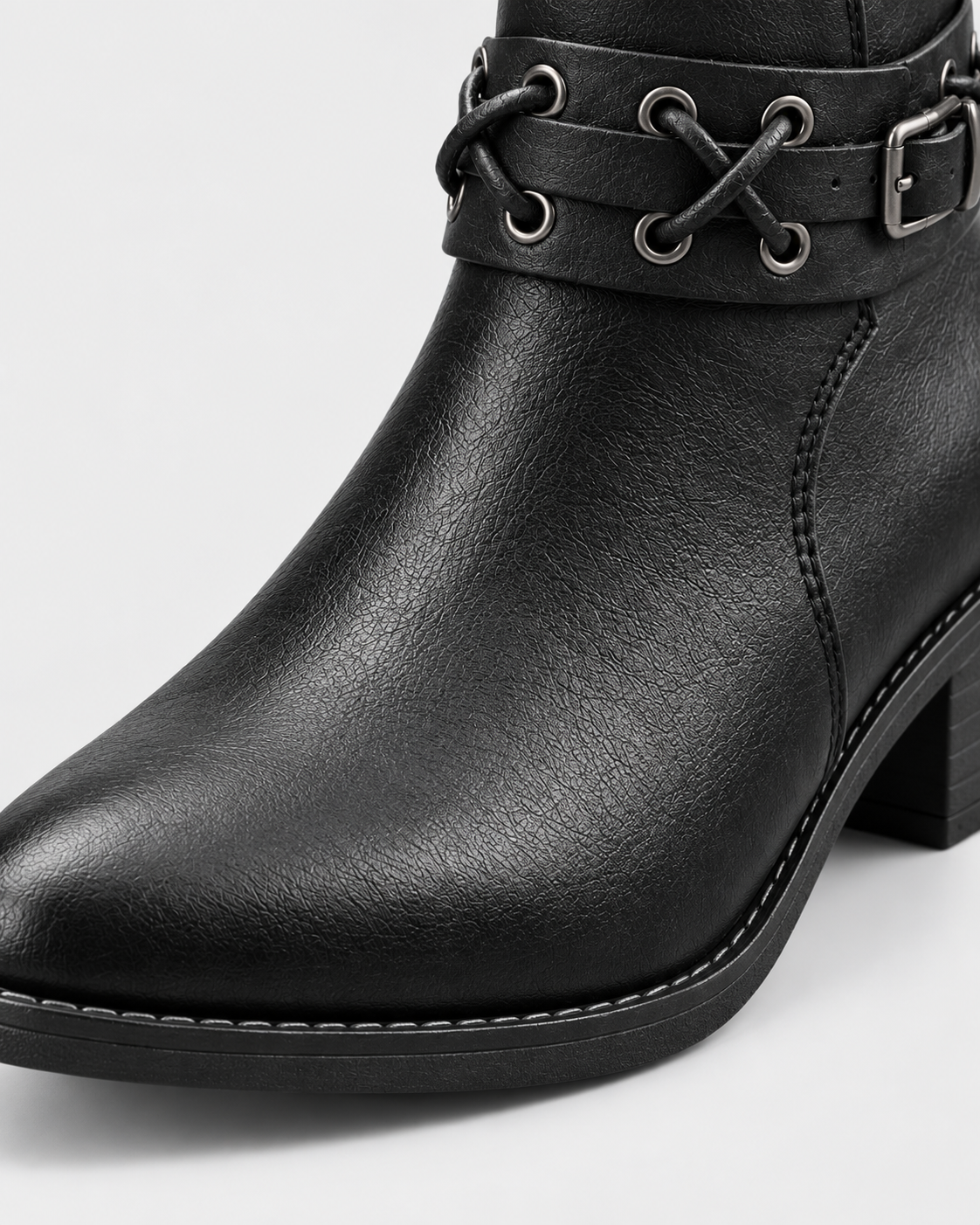 Image of black | Close-up of pointed toe on black faux leather ankle boot