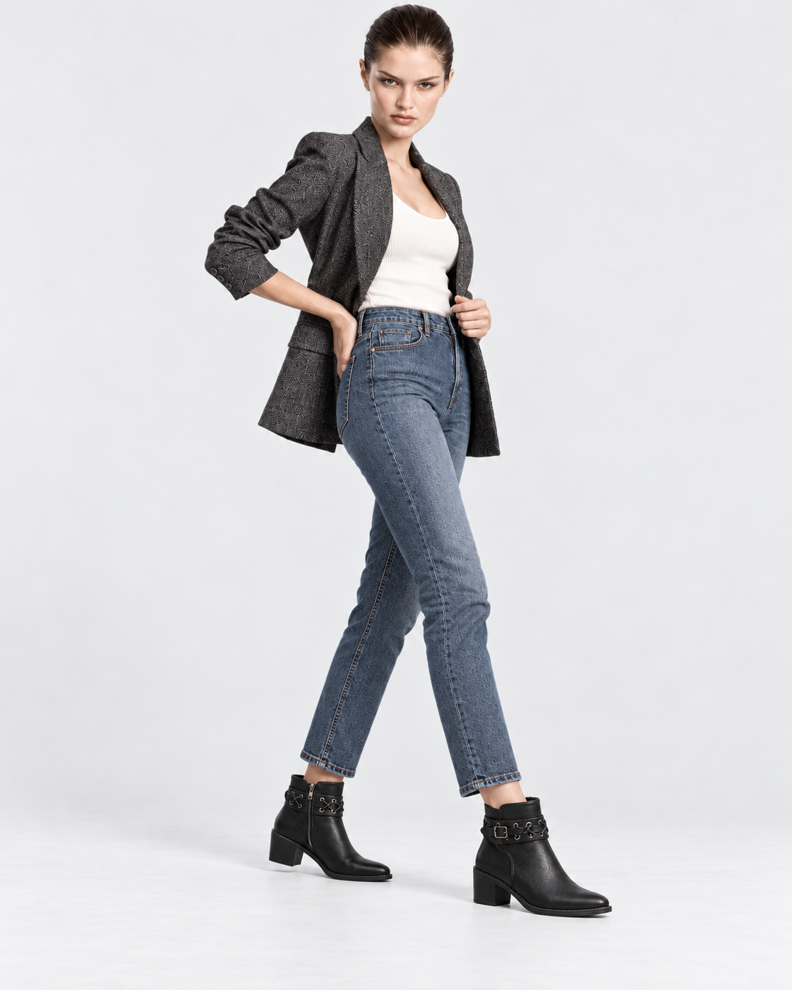 black | Model styling women's black rivet buckle ankle boots, alternate pose