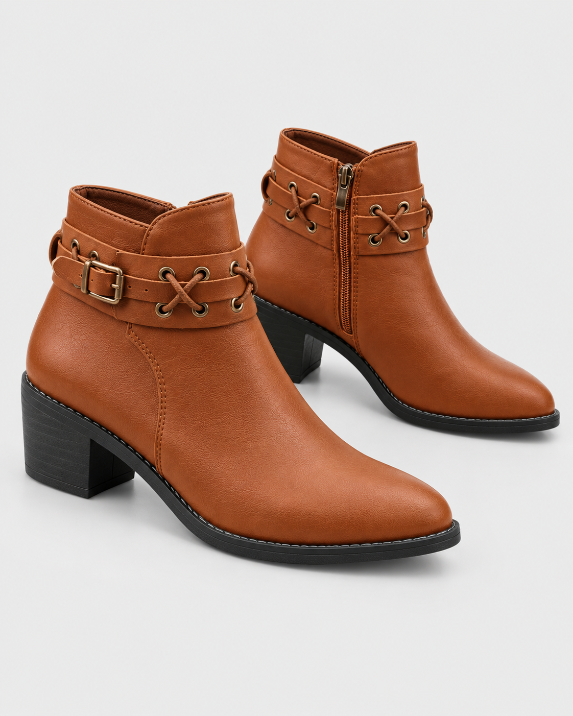 Image of Light Brown | Pair of light brown pointed-toe ankle boots showing buckle trim