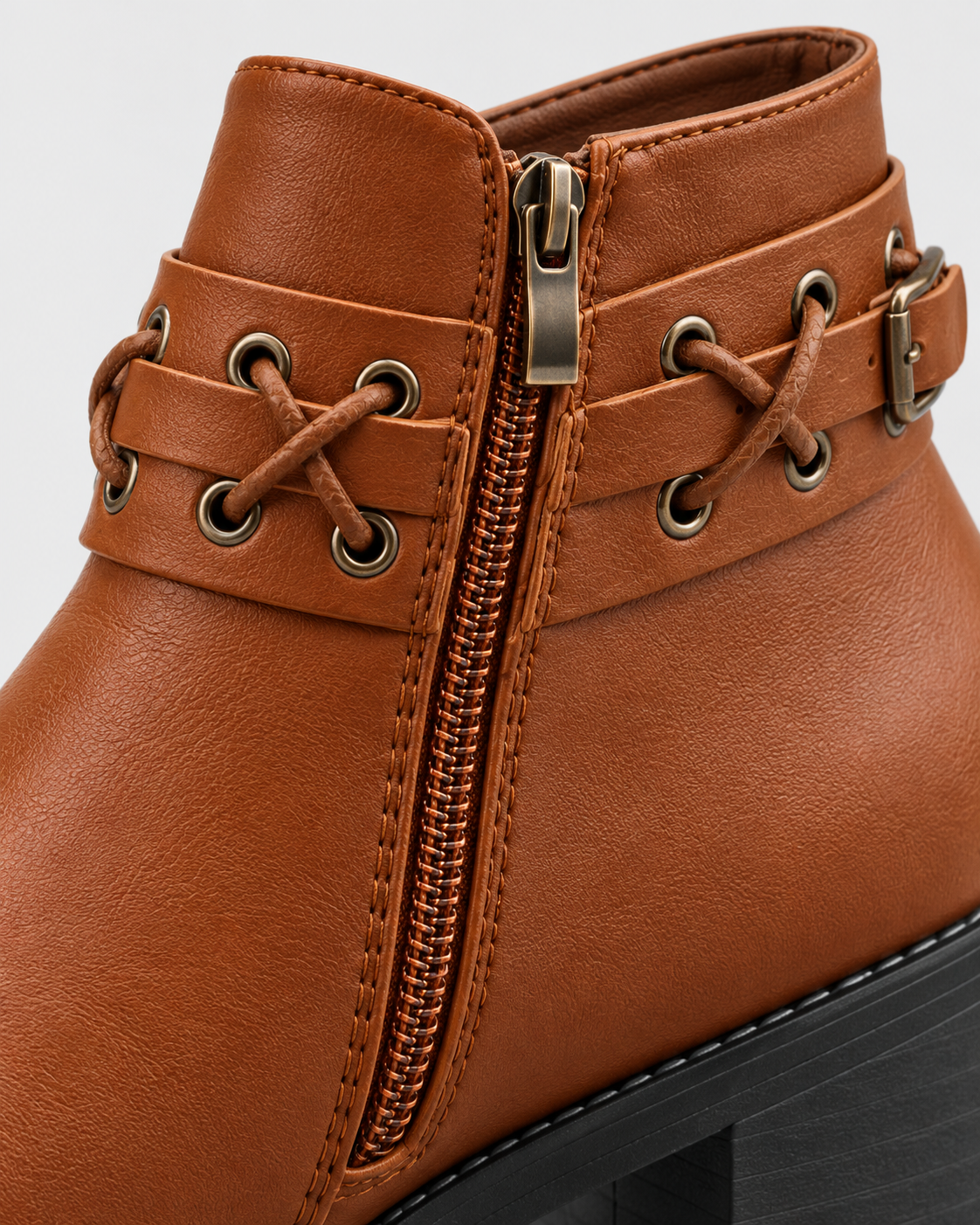 Light Brown | Close-up of side zipper and metal buckle on tan faux leather boot