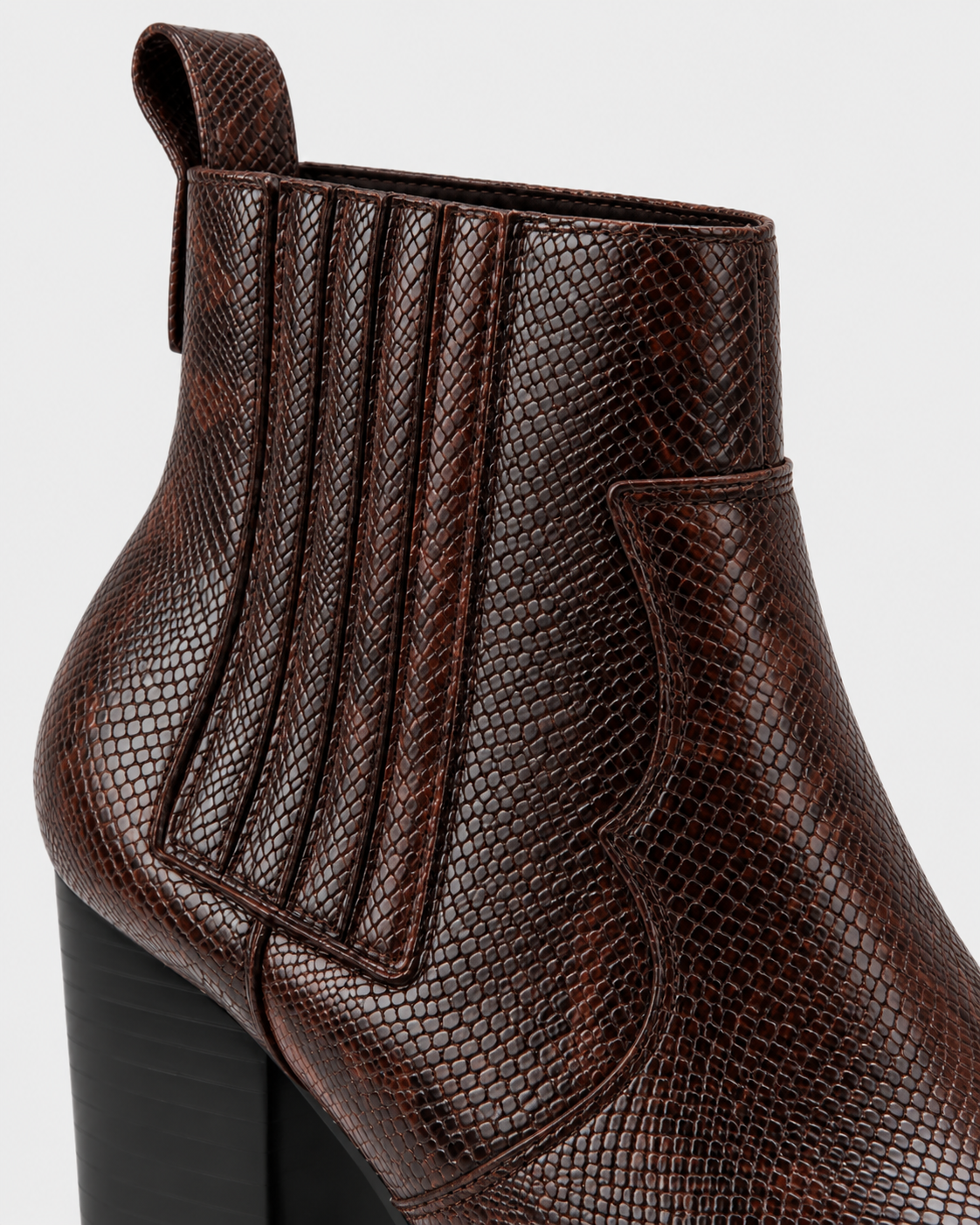 Image of Brown | Close-up of elastic side panel and snakeskin-print upper