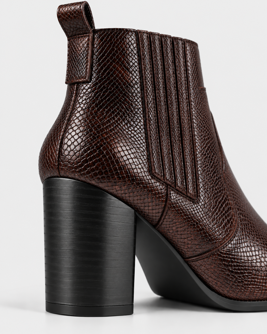 Image of Brown | Close-up of brown ankle boot heel and textured upper