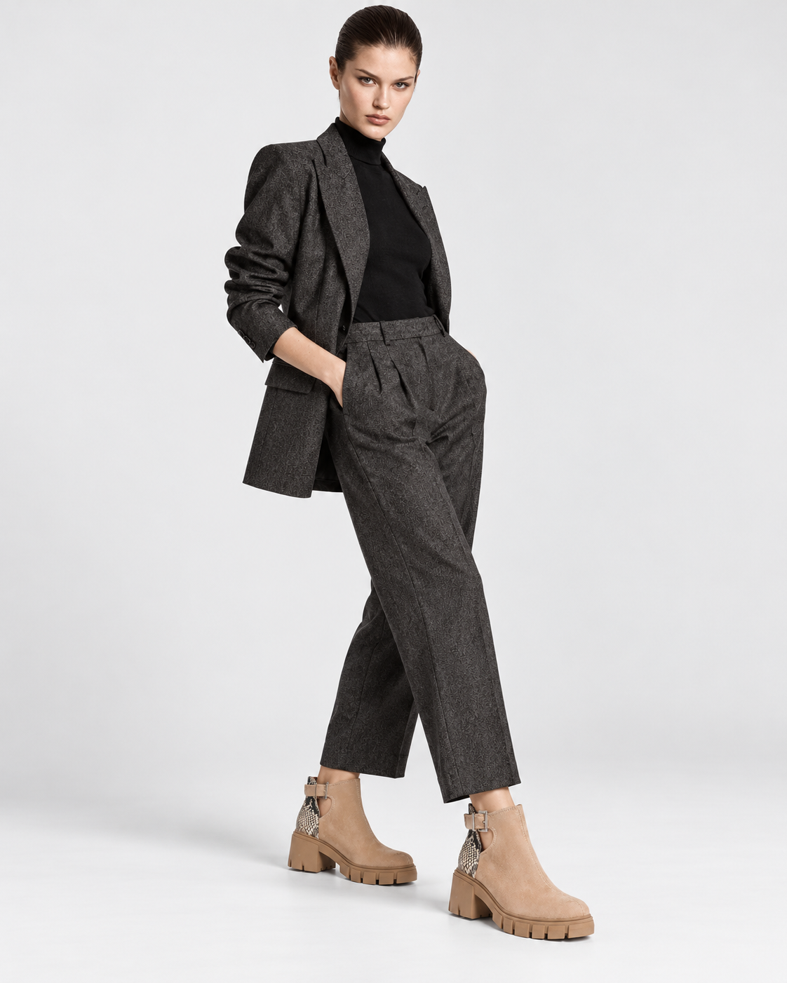 Apricot | Model standing in apricot ankle boots with snakeskin-print heel panels