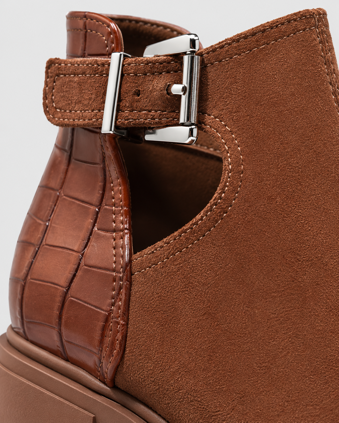 Image of Brown | Close-up of buckle strap and snakeskin-texture accent on ankle boot