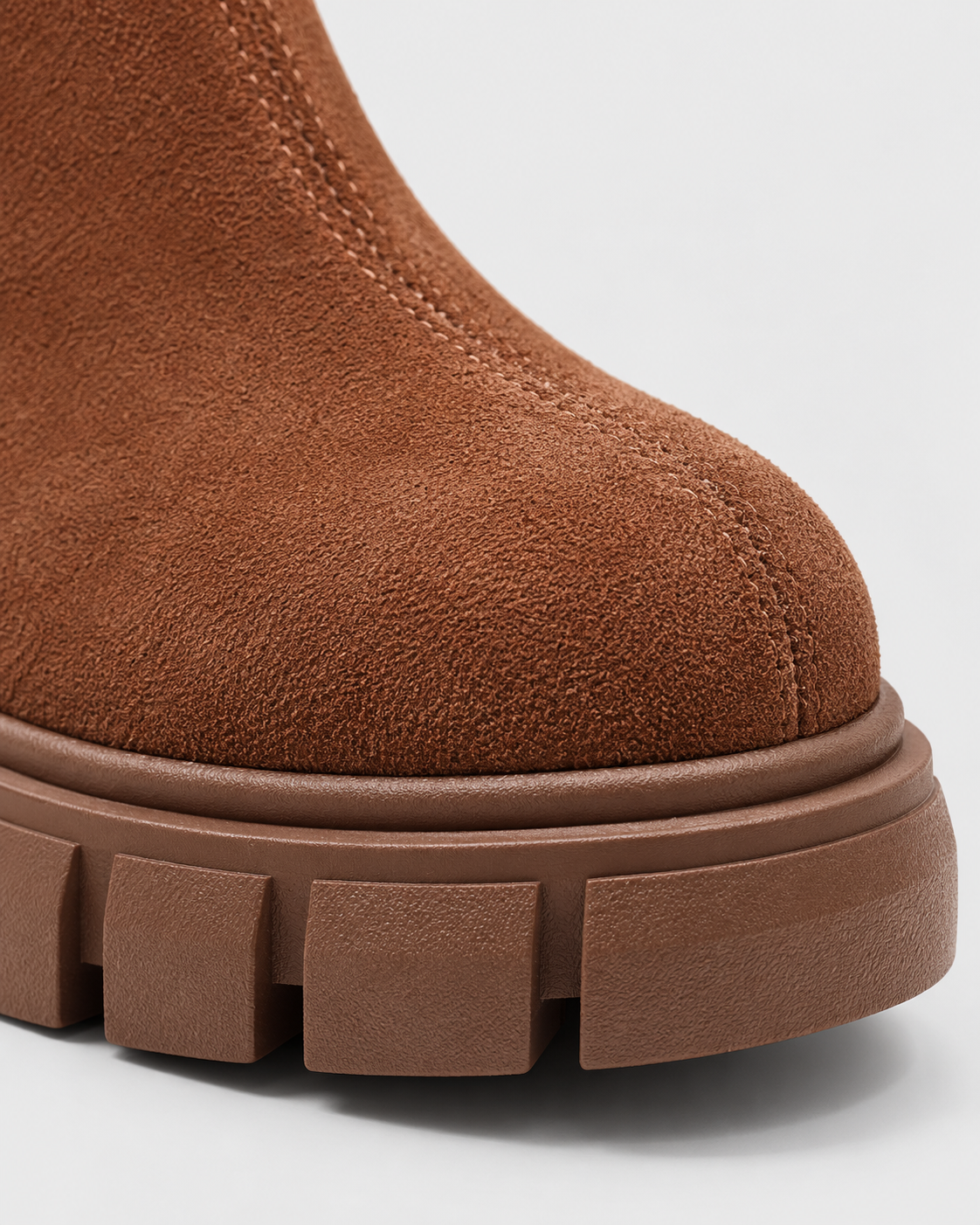 Brown | Close-up of toe and chunky rubber-look lug sole on brown ankle boot