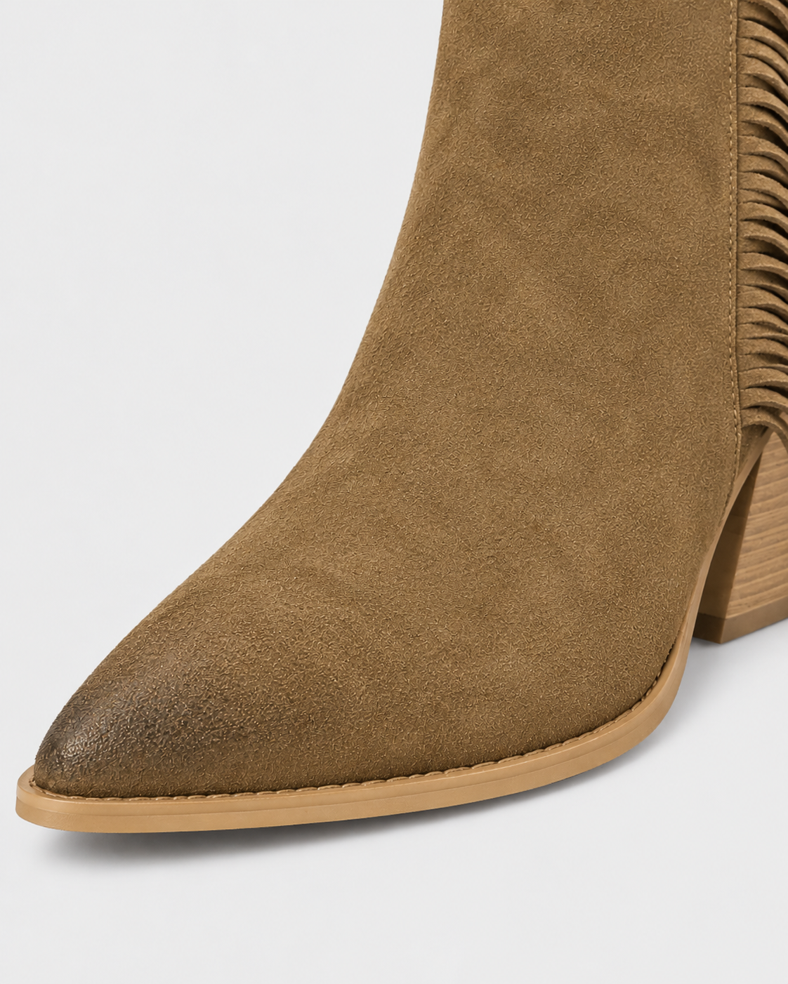 Image of Earth Yellow | Close-up of pointed toe and suede-look upper on western ankle boot