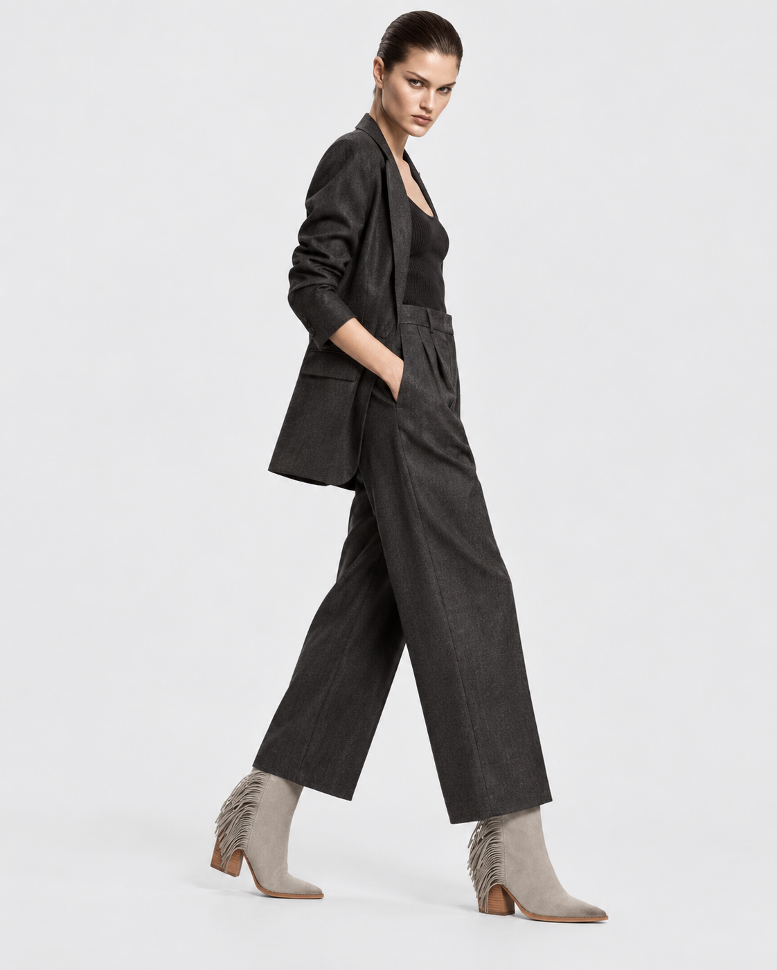 Image of Gray | Model wearing gray tassel western ankle boots in an alternate pose
