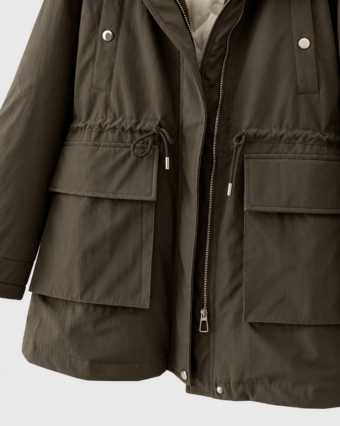 Image of Army Green | Close-up of drawcord waist and cargo pockets on jacket
