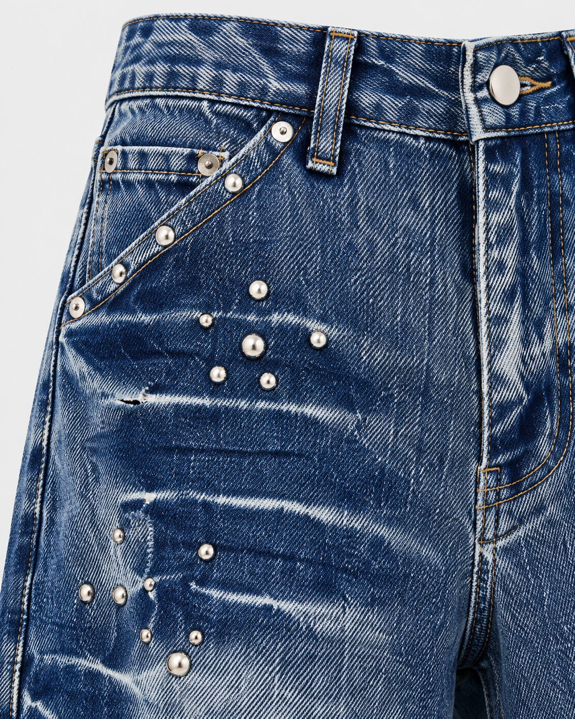 Blue | Close-up of front waistband, button and metallic rivet detailing
