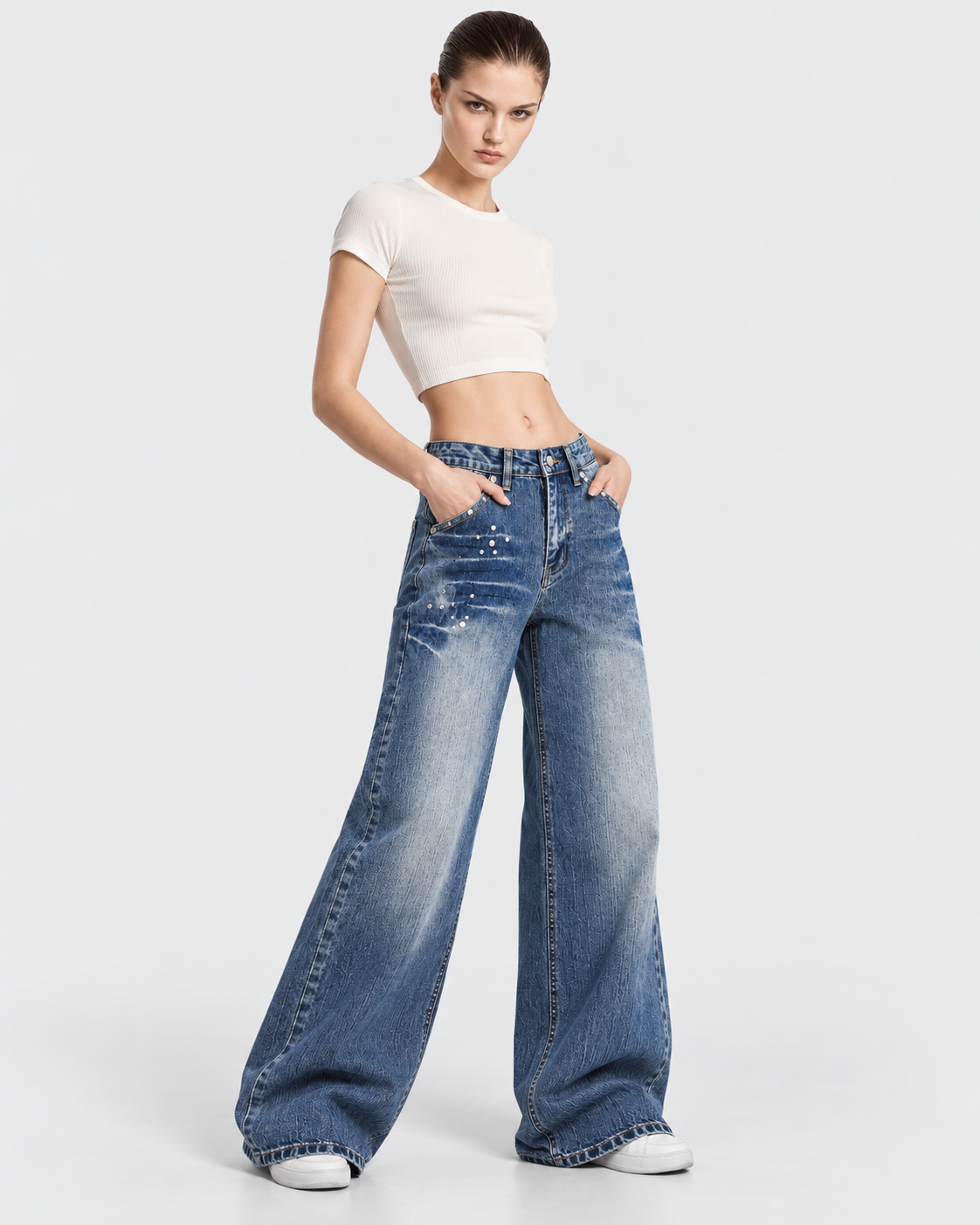 Image of Blue | Model styling women's washed rivet wide-leg jeans, alternate pose