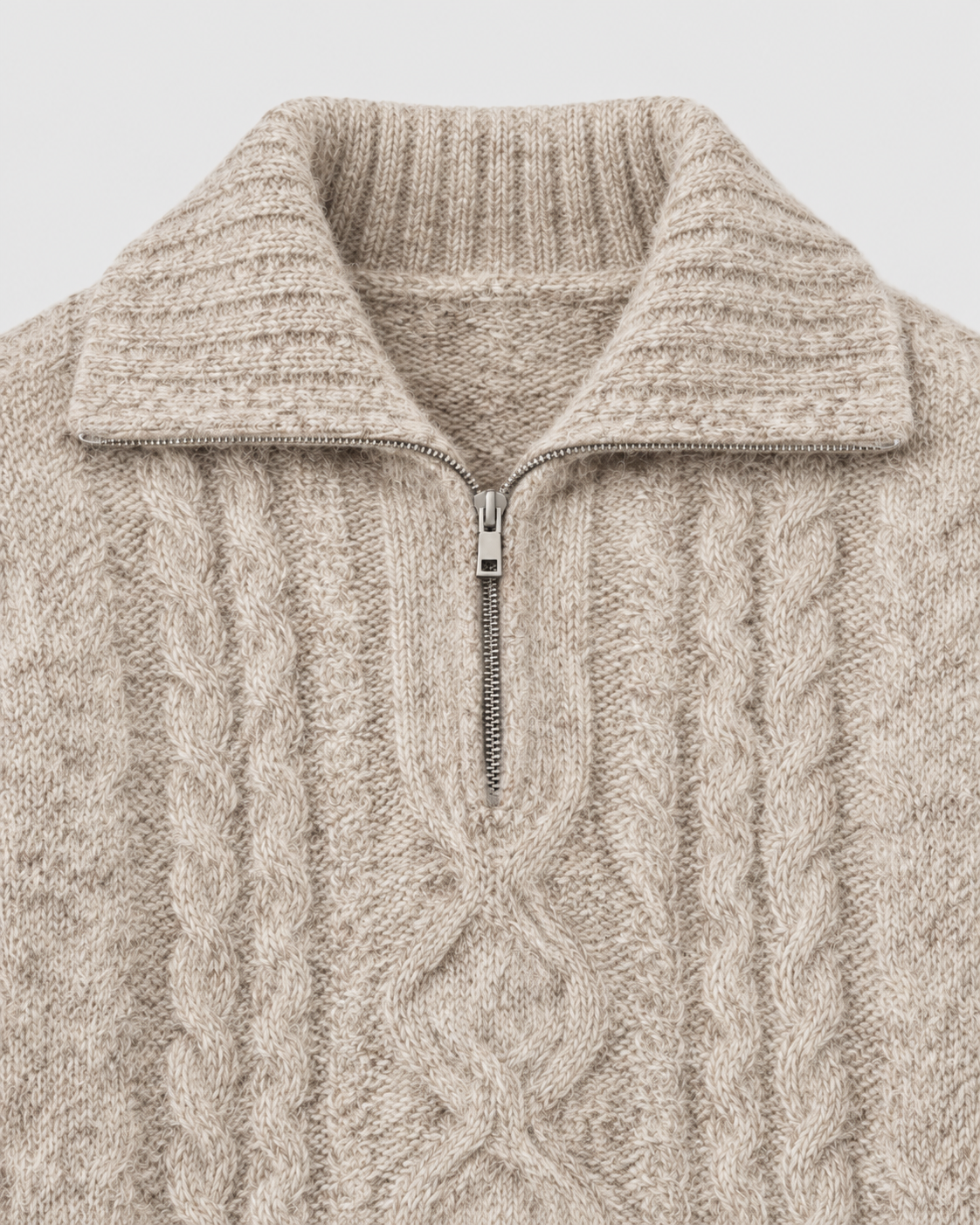 Oatmeal | Close-up of the zip collar and neckline on cable-knit sweater