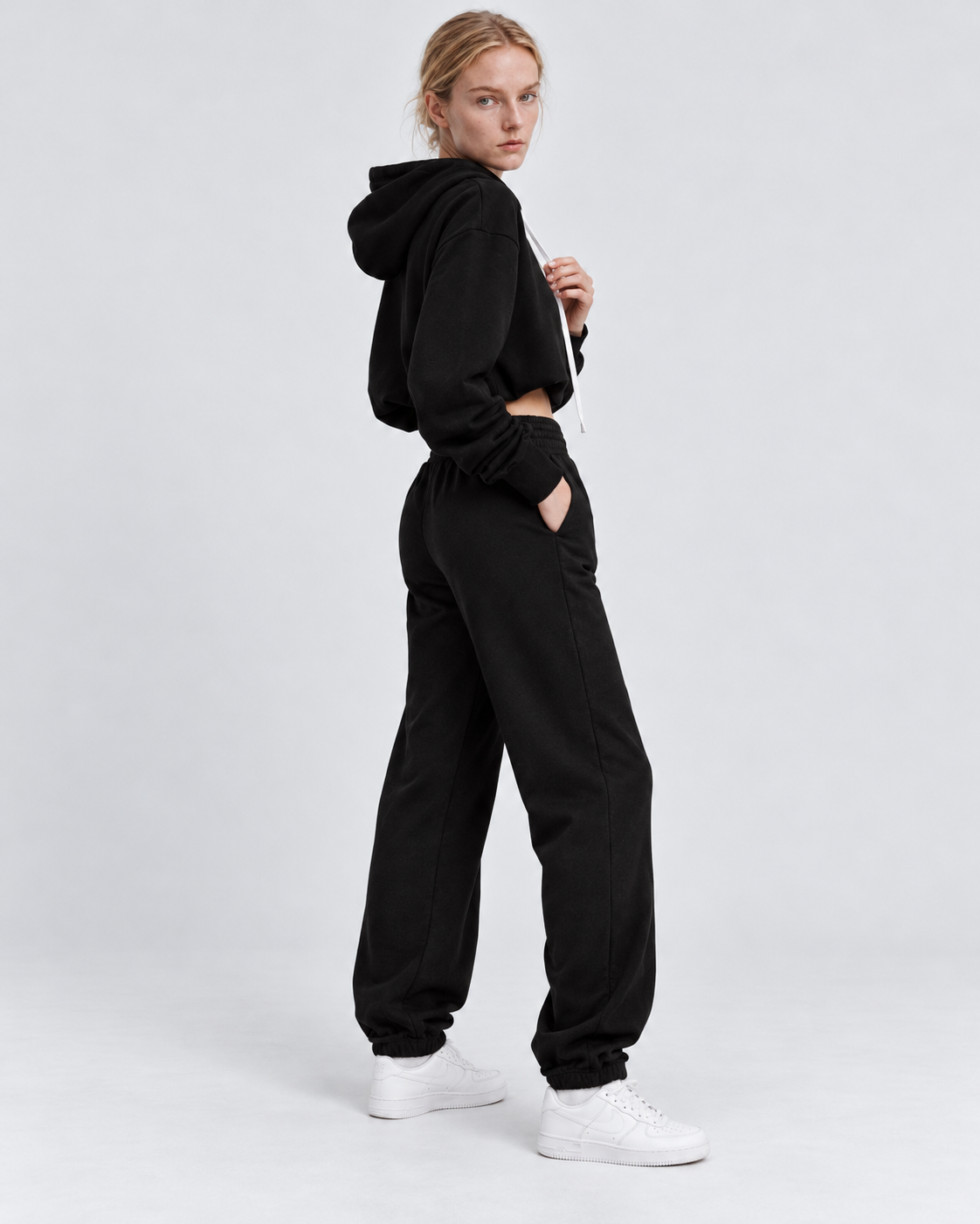 Color: Active Black | Women's active black raw-edge cropped cotton pullover hoodie styled on model, look 1