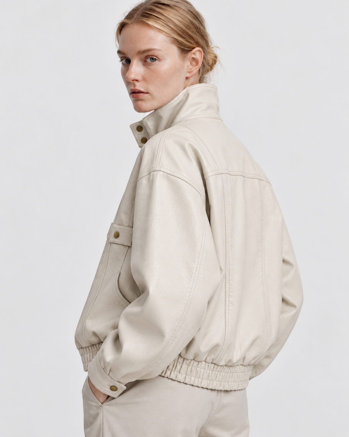 Color: Apricot | Women's apricot washed faux leather zip-up jacket styled on model, look 2