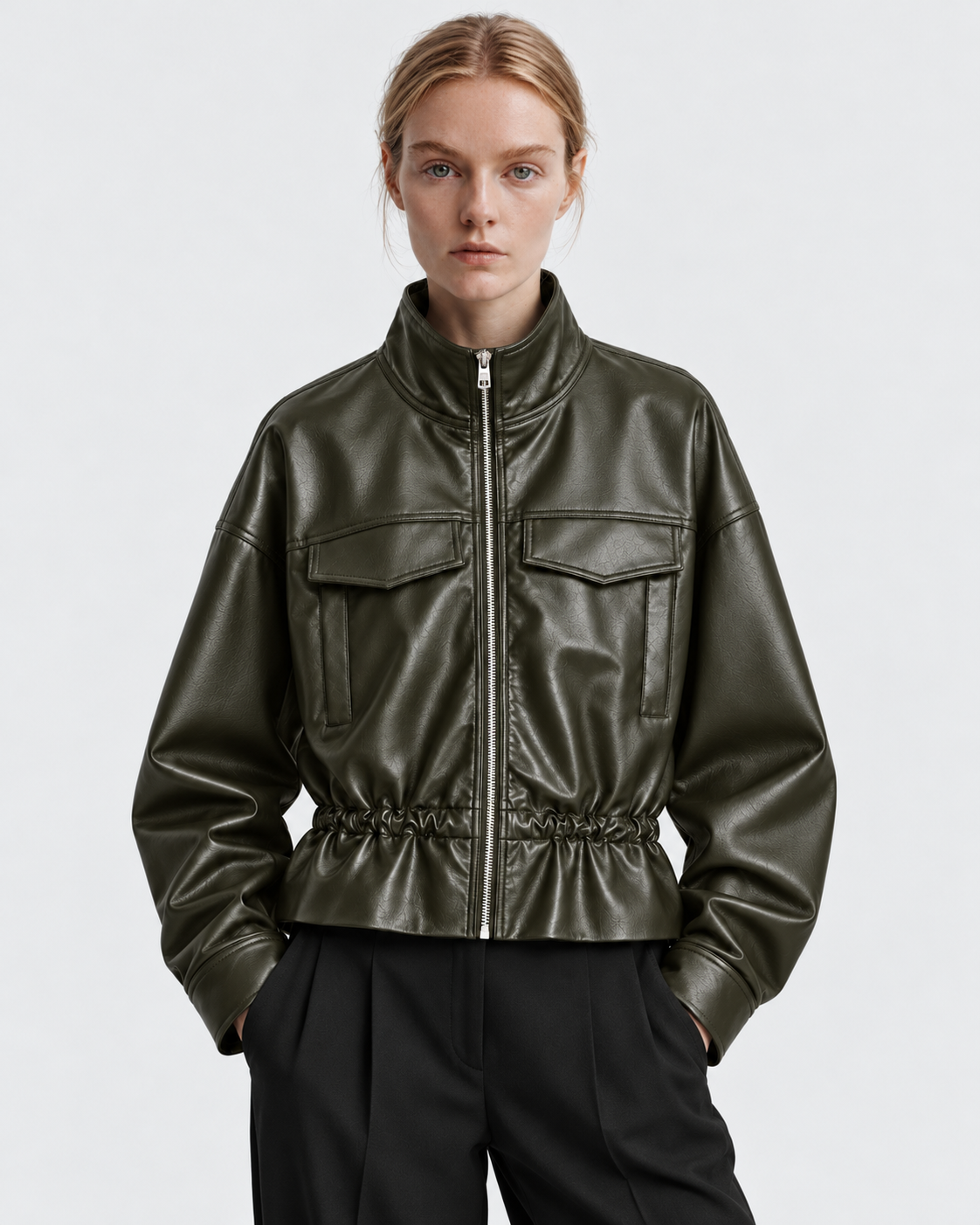 Color: Army Green | Women's army green stand collar faux leather zip-up jacket styled on model, front view