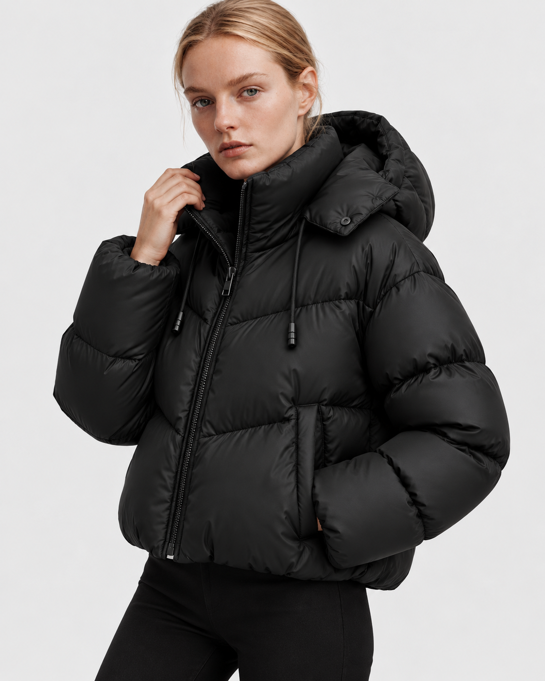 Image of Color: Black | Women's black quilted puffer jacket styled on model, three-quarter view