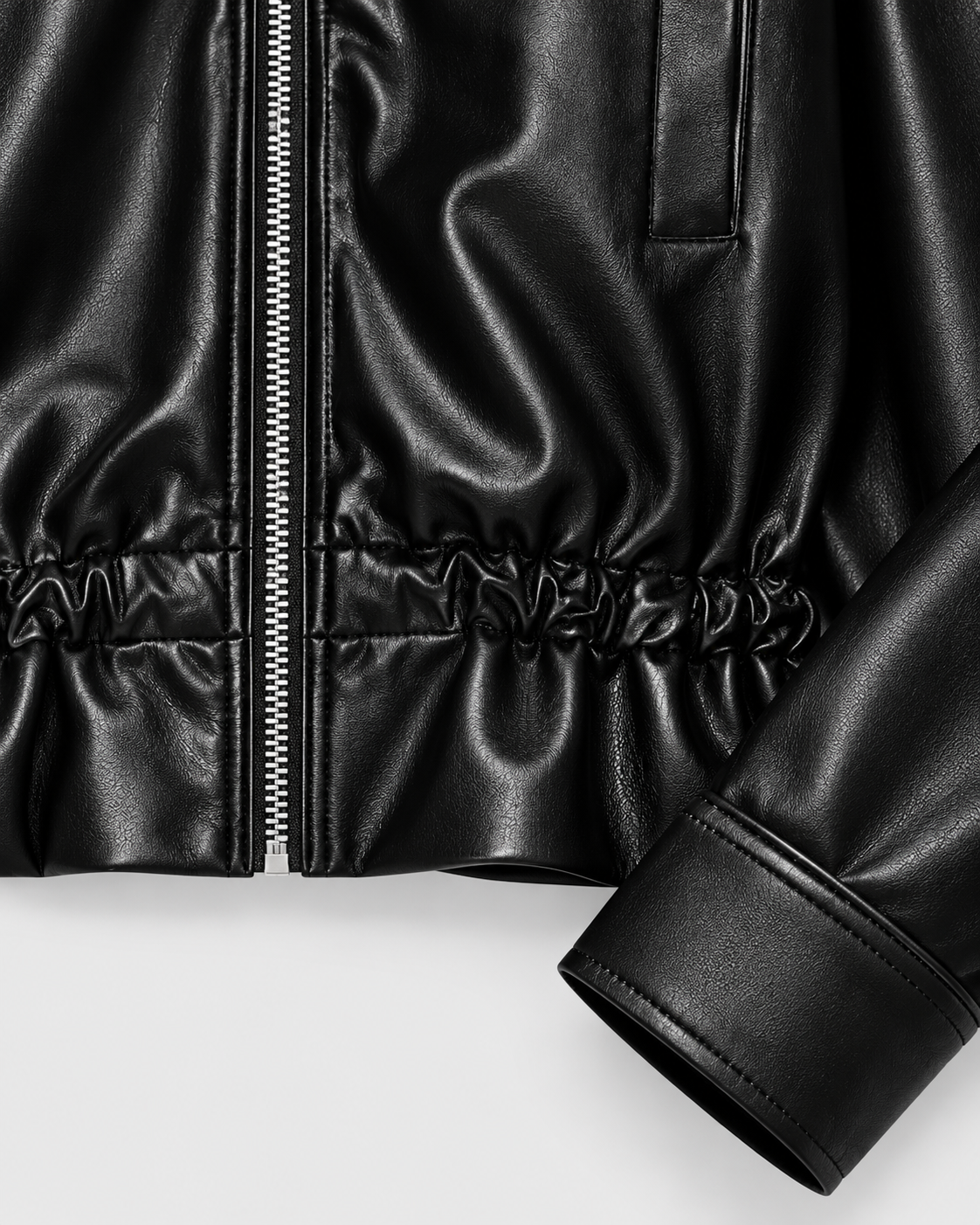 Image of Color: Black | Elastic hem and cuff detail on women's black faux leather jacket