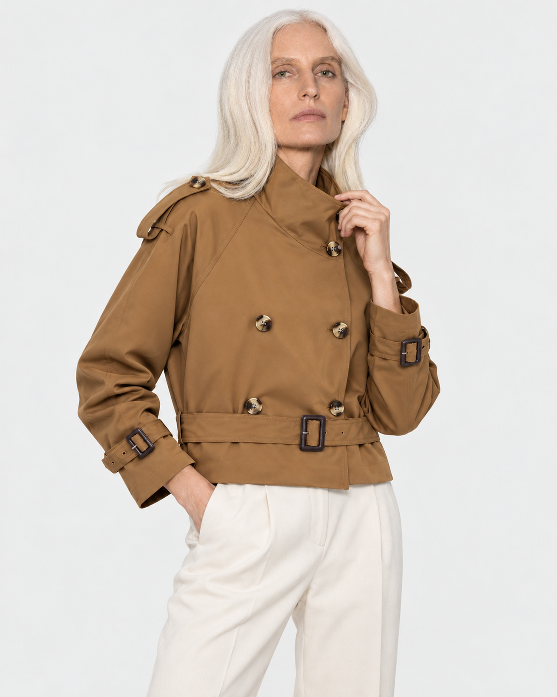 Color: Camel | Women's camel short double-breasted belted trench coat styled on model, look 2