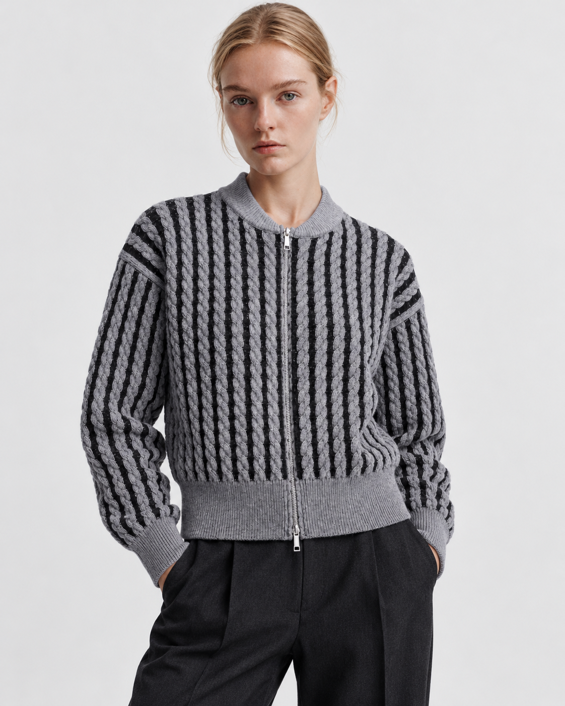 Color: Gray | Women's gray striped cable knit zip-up cardigan styled on model, front view
