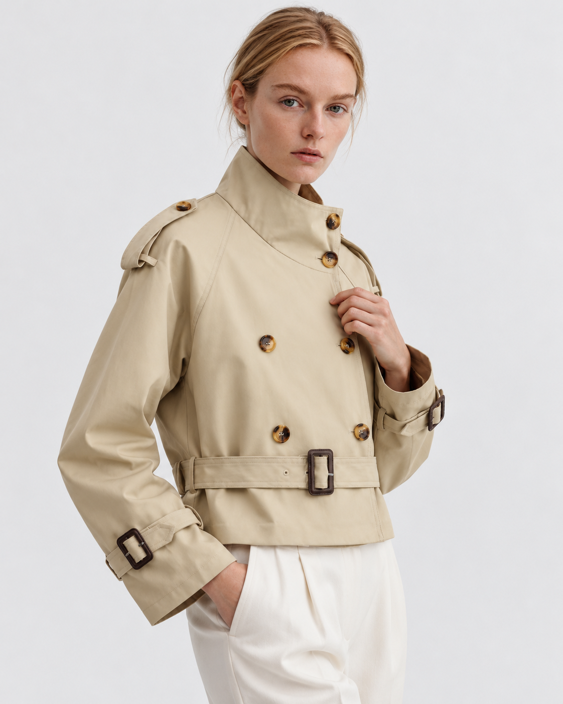 Color: Khaki | Women's khaki short double-breasted belted trench coat styled on model, look 2