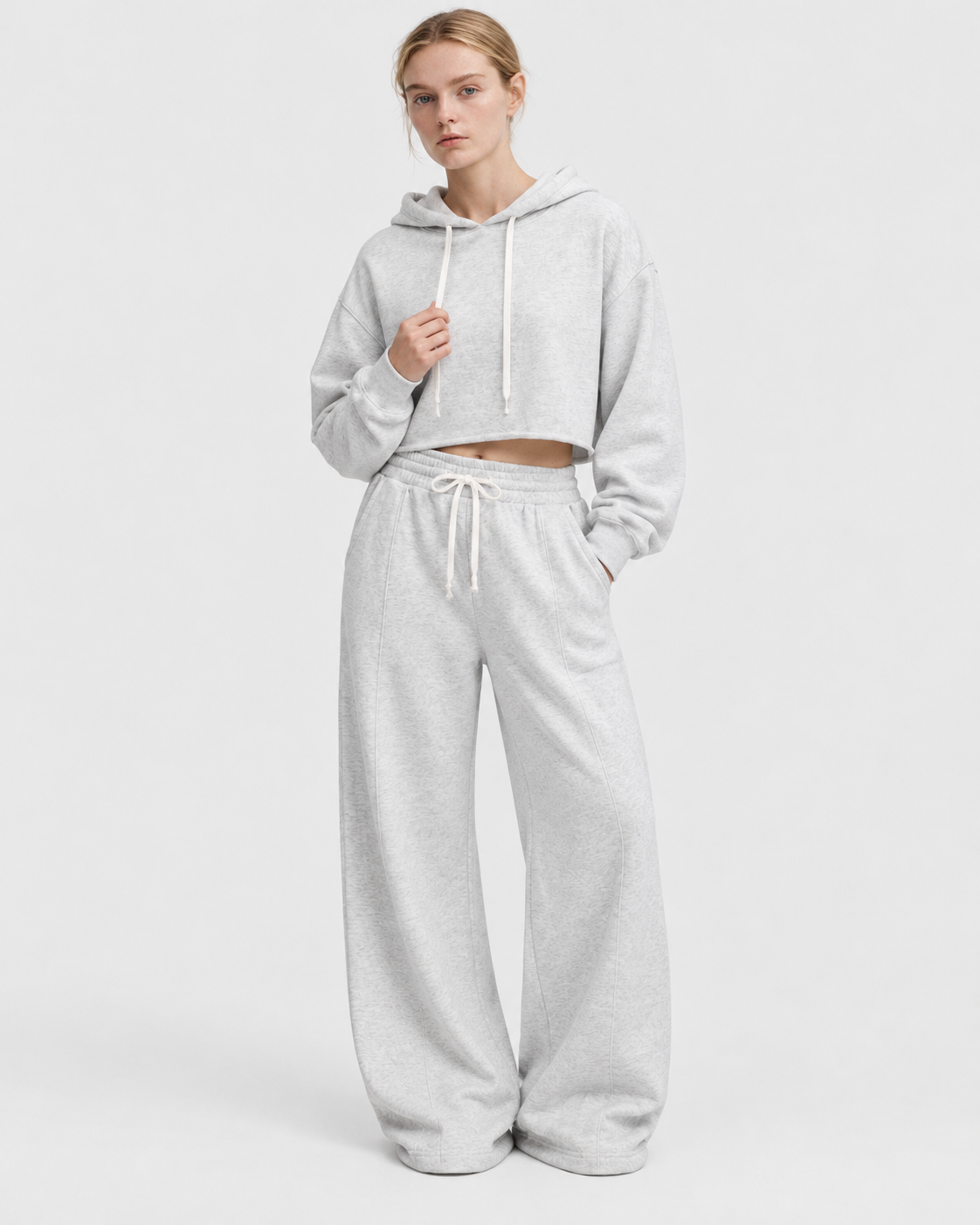 Image of Color: Light Floral Gray | Women's light floral gray raw-edge cropped cotton pullover hoodie styled on model, look 2