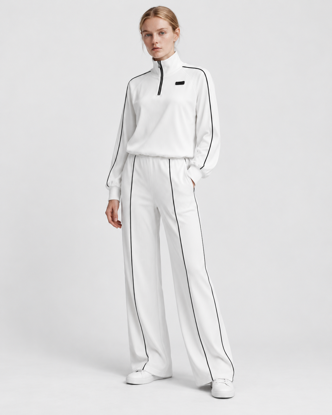 Color: White | Women's white relaxed fit hoodie and wide leg pants set styled on model, three-quarter view