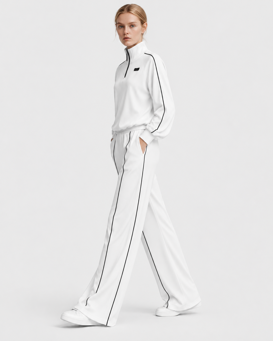 Color: White | Women's white relaxed fit hoodie and wide leg pants set, three-quarter studio view